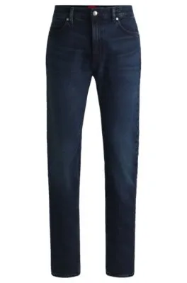 Jeans slim fit en denim elástico azul oscuro